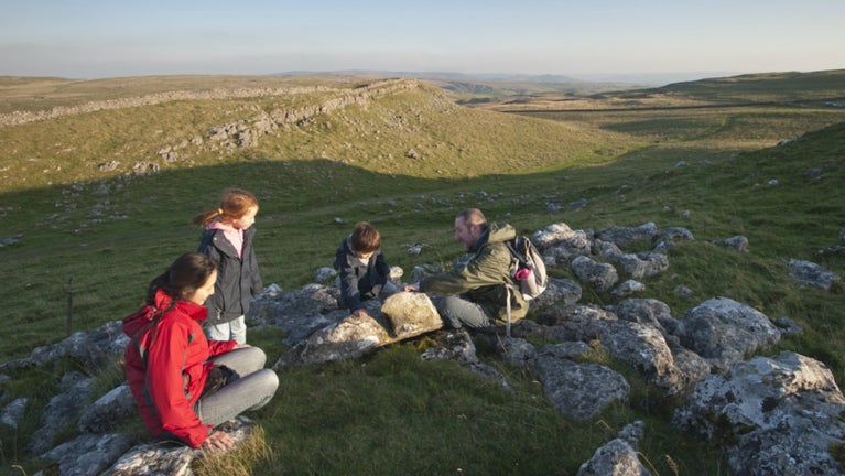 Family on a walk around Malham Moor in the Yorkshire Dales
